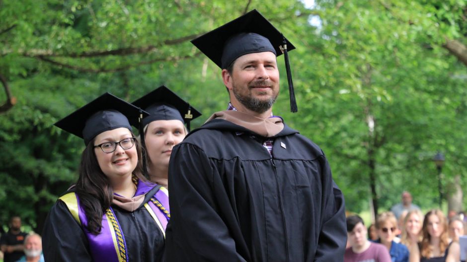 Graduating students in commencement regalia