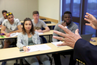 Photo of Teacher in Front of Class