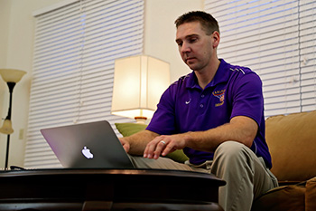 Student Studying at Home on Laptop