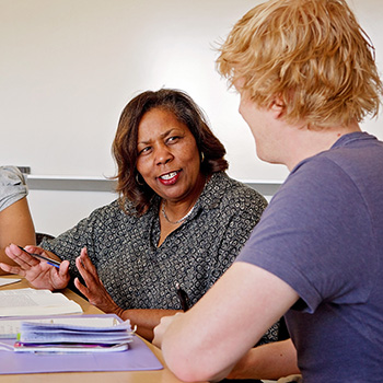 Female Professor Working with Male Student