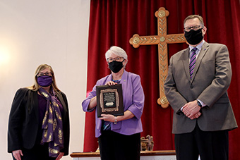 Dr. Christine Bahr (center), who recently retired as the university provost, received a special Social Justice and Equity Award from Dr. Tami Eggleston, provost, and President Daniel Dobbins.